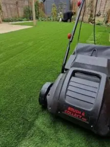 Close up of professional artificial lawn cleaning equipment